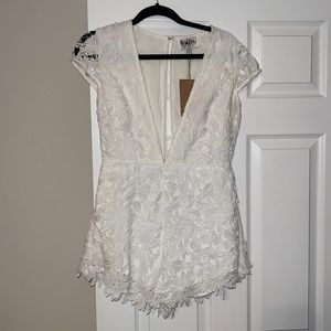 Pretty white lace plunging neckline romper